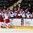 GRAND FORKS, NORTH DAKOTA - APRIL 21: Russia's Pavel Dyomin #8 and Klim Kostin #24 celebrate at the bench after a third period goal against Finland during quarterfinal round action at the 2016 IIHF Ice Hockey U18 World Championship. (Photo by Minas Panagiotakis/HHOF-IIHF Images)


